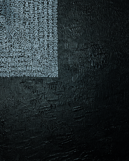 Black textured surface with a white geometric pattern on the left side